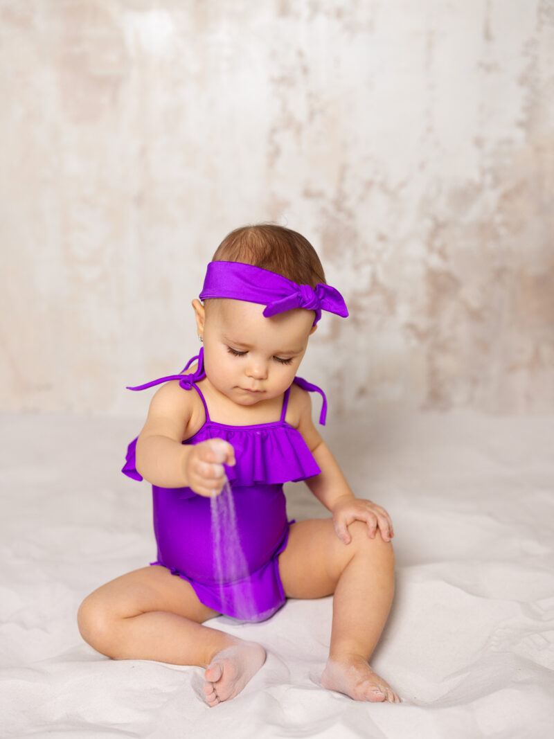 Purple baby swimsuit with headband