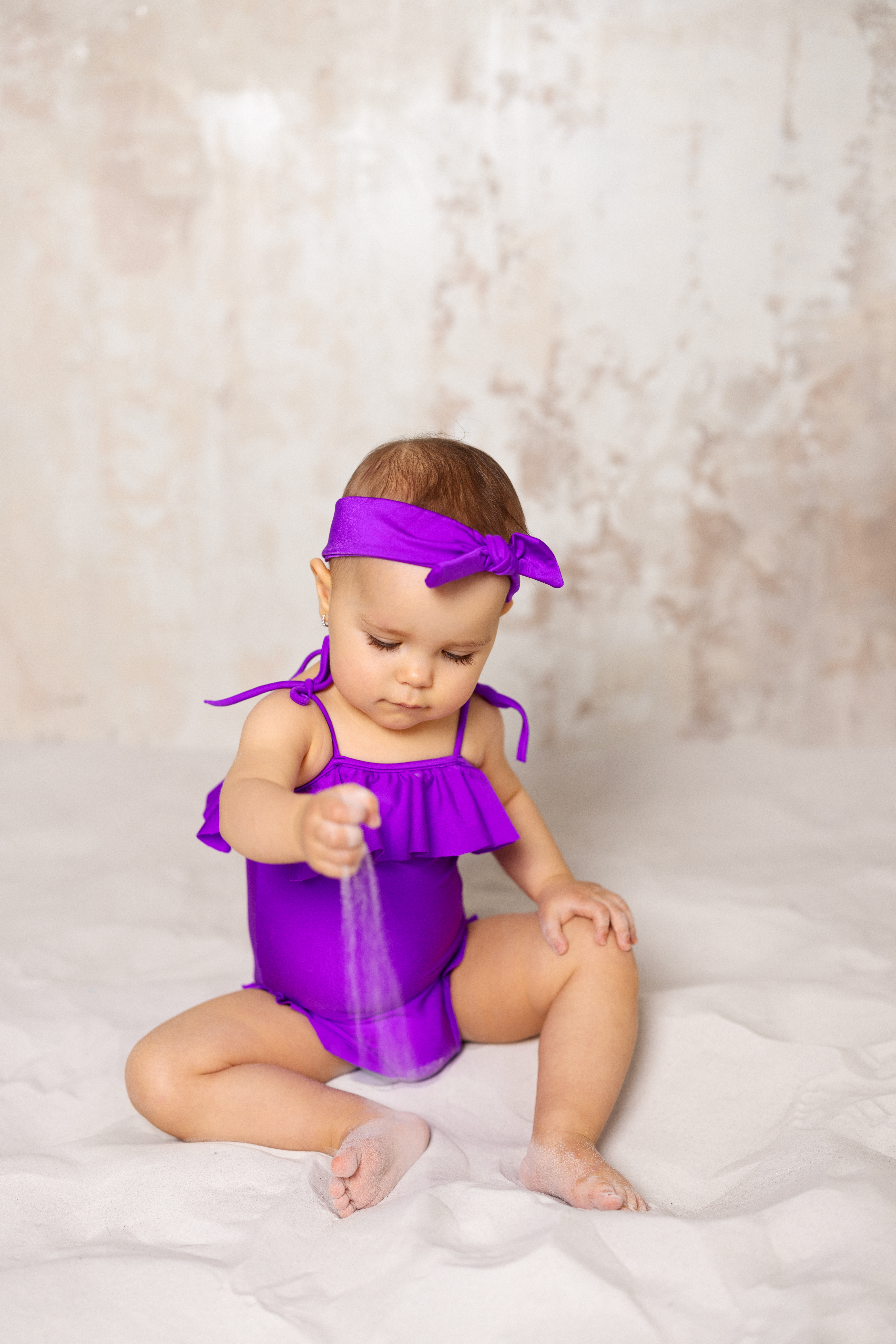 Purple baby swimsuit with headband