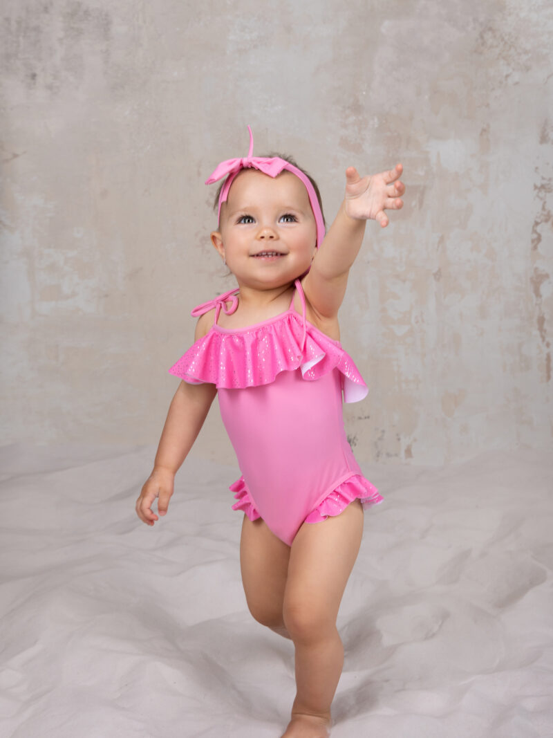 Pink baby swimsuit with headband